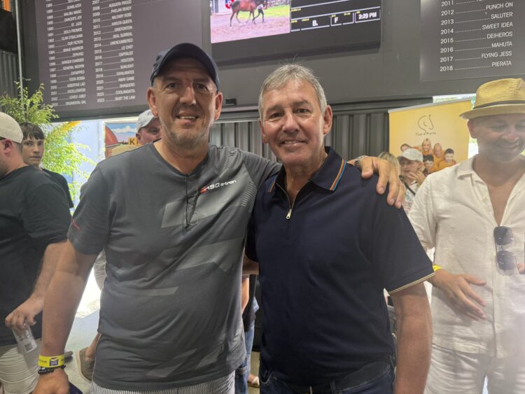 Manny Gelagotis with former Manchester United star Bryan Robson