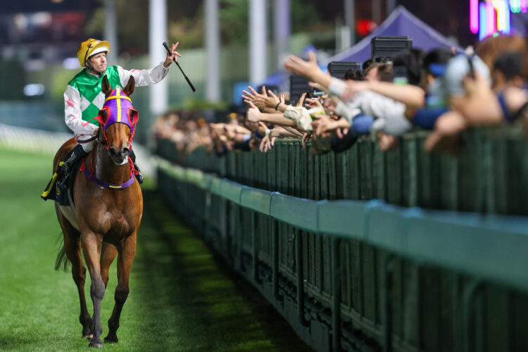 Hugh Bowman celebrates aboard Motor as the Hong Kong Derby-winning jockey completed a treble at Happy Valley. [HKJC]