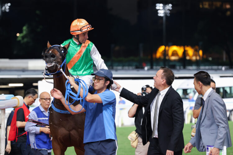 Caspar Fownes and Joao Moreira celebrate after completing a double at Happy Valley on Wednesday night.