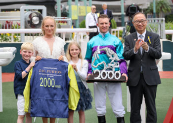 Zac Purton and his family with The Hon Martin Liao, Chairman, The Hong Kong Jockey Club, after the Australian rode a 2,000th winner in Hong Kong.
