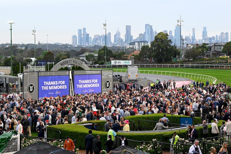 Punters walk on the track to mark the final race before the redevelopment of the course at Cox Plate Day at Moonee Valley Racecourse on October 25, 2025 in Moonee Ponds, Australia. (Photo by Adam Trafford/Racing Photos)